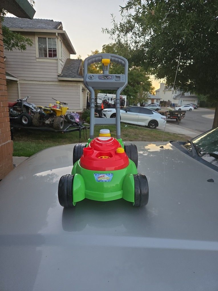 Toy Lawnmower that blows out bubbles. 