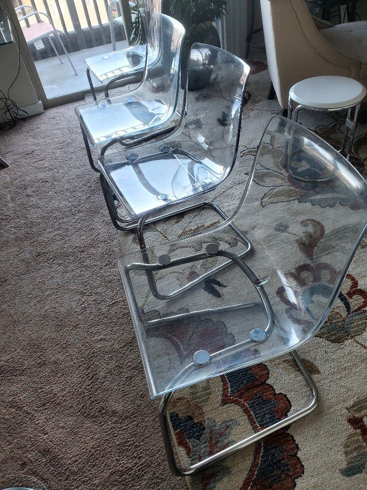 Set Of 4 Clear Chairs