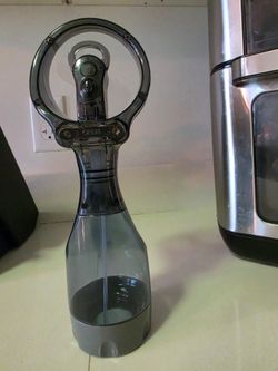 Gray fan that sprays water