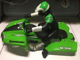 Traxxas Emaxx 3906 monster truck with HPI Racing ATV & Doll