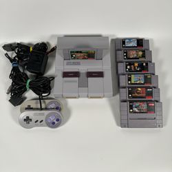 Super Nintendo Console W/ OEM Power Cord & AV Cord And 7 Games!