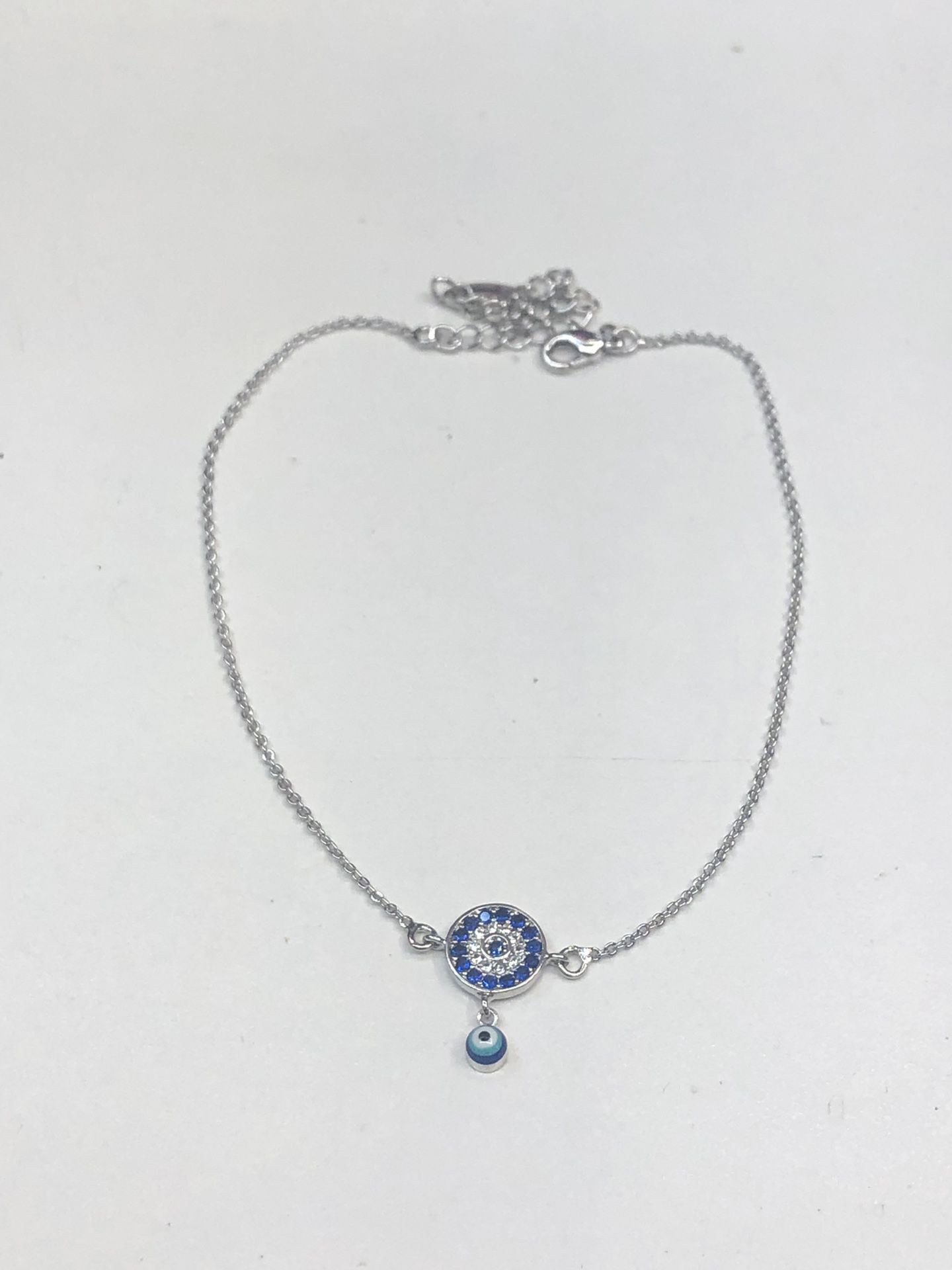 A beautiful cubic zirconia stones Eye rhodium dipped anklet with dropping Eye stone best quality I got all lengths best quality!! Shipping is free