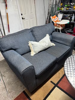 Blue sofa and metal round table