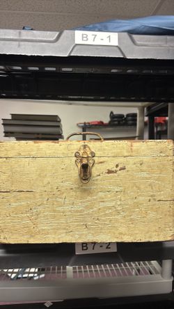a wooden box with 6 Different Fishing Reels Different Brands 1 Light Weight Spool