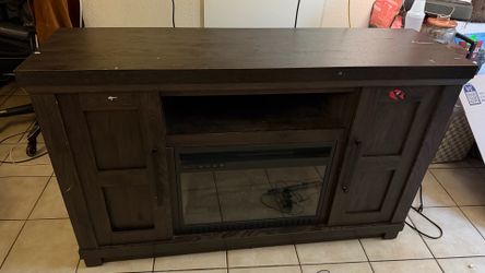 Entertainment console with electric heater