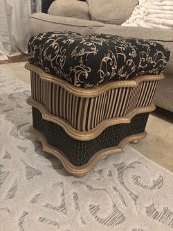 Ornate Black and Gold Upholstered Ottoman