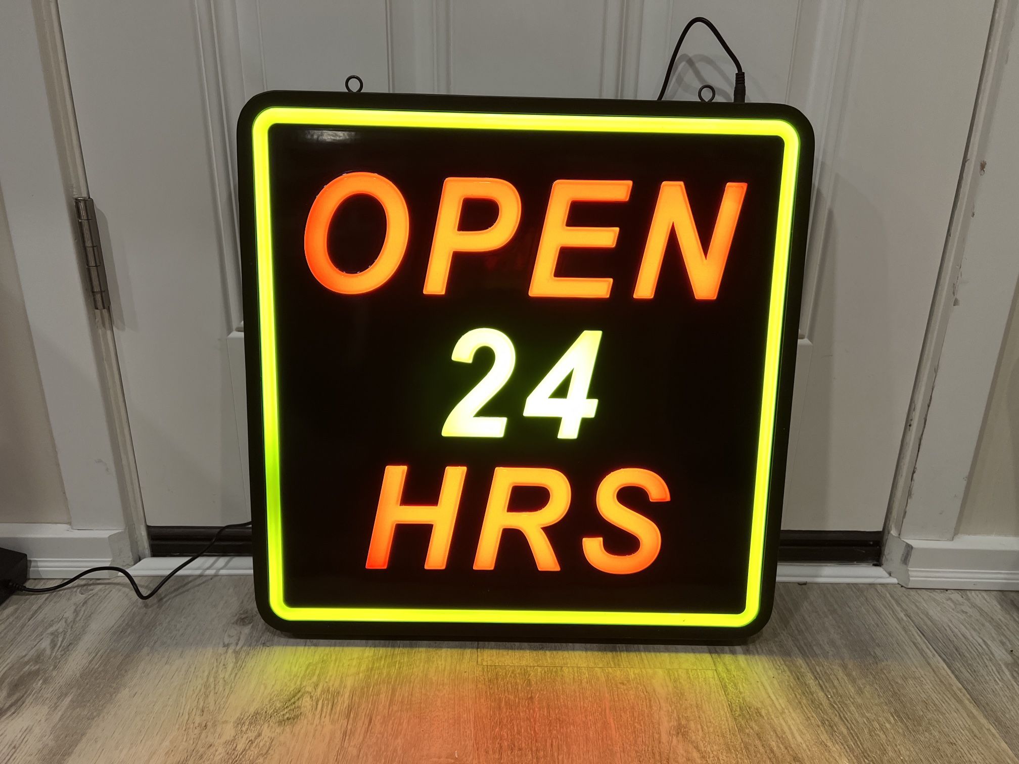 Lit “OPEN 24 HRS” sign