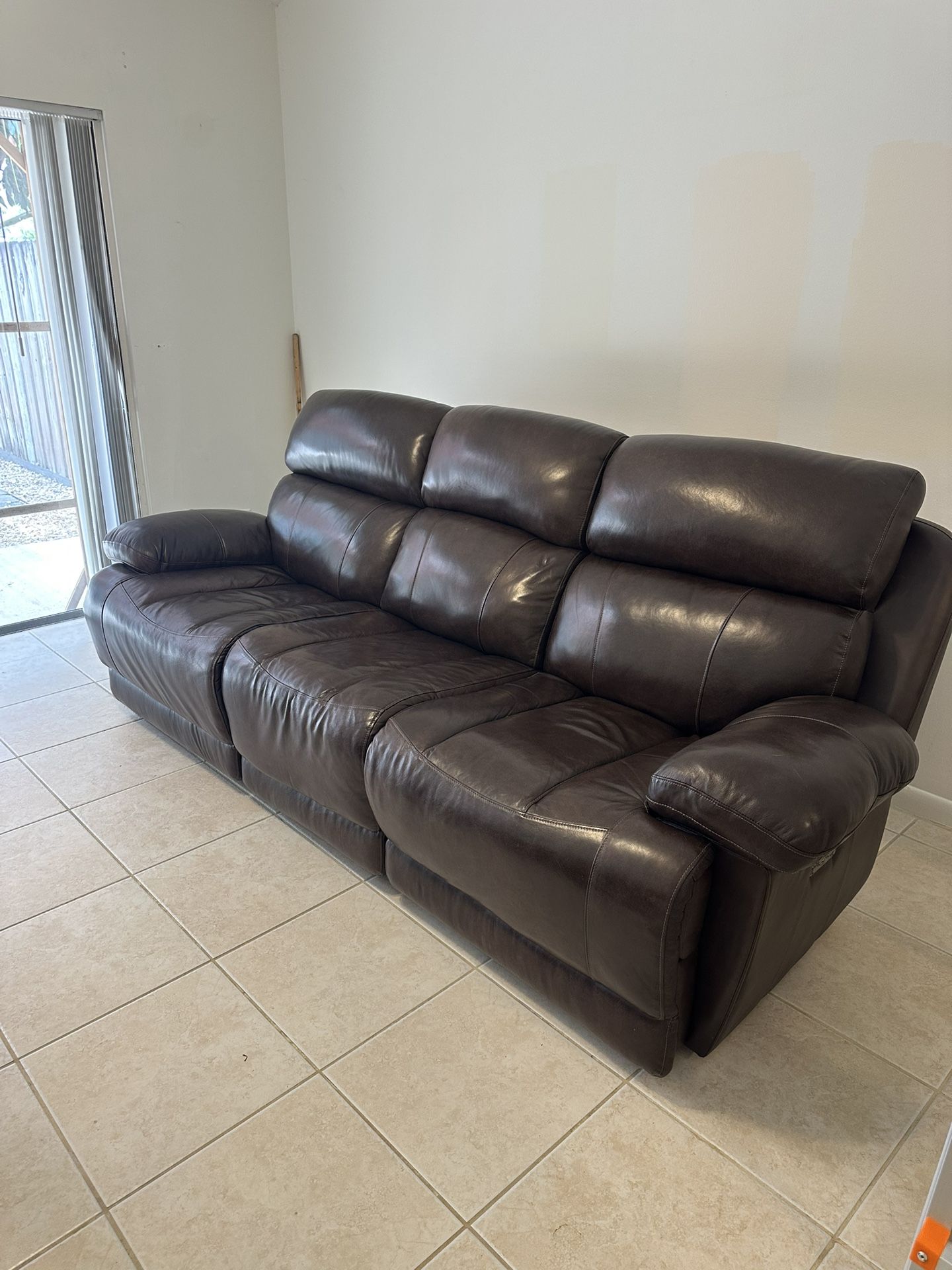Brown faux leather sofa