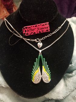 Angel wings Betsey Johnson sweater necklace or pendant in gold tone. Brand new.