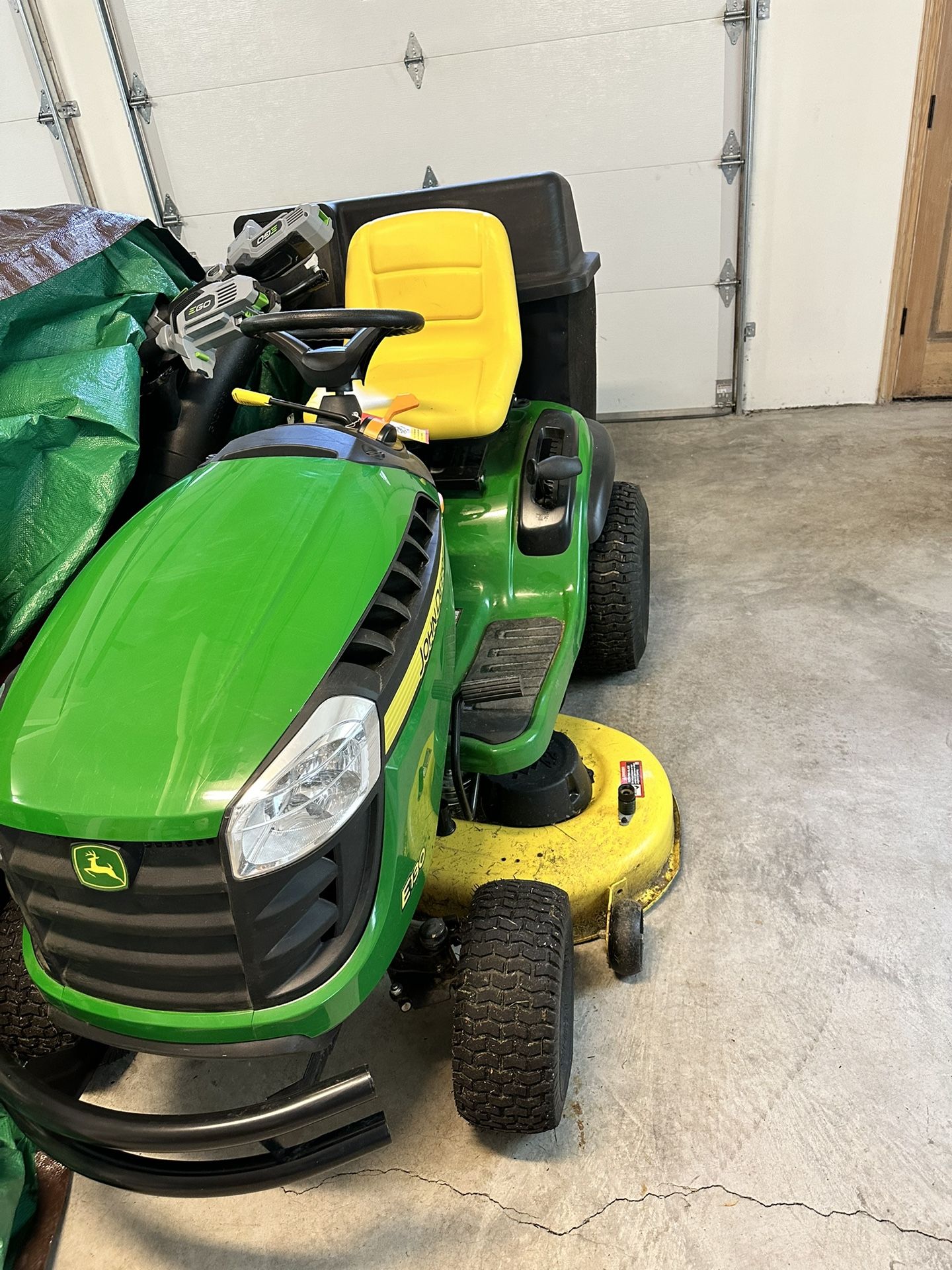 John Deere Like new and Garaged Model E130 Lawn Mower With Additional Accessories In
