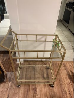Gold colored bar cart