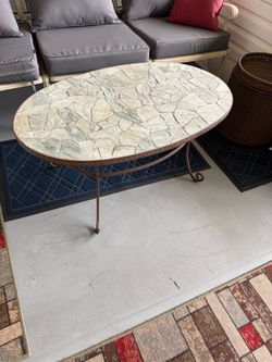 Heavy duty porch coffee table , iron with rock surface