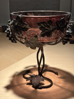 vintage Italian centerpiece coupe is crafted from hand-blown purple Murano glass paired with a sculptural wrought iron grape and vine base