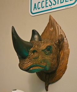 Wooden Rhino With Black Leather Hornes