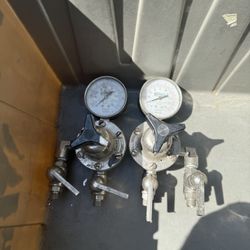 Binks air pressure regulator, which is a device used to control and maintain a consistent air pressure in pneumatic systems.  