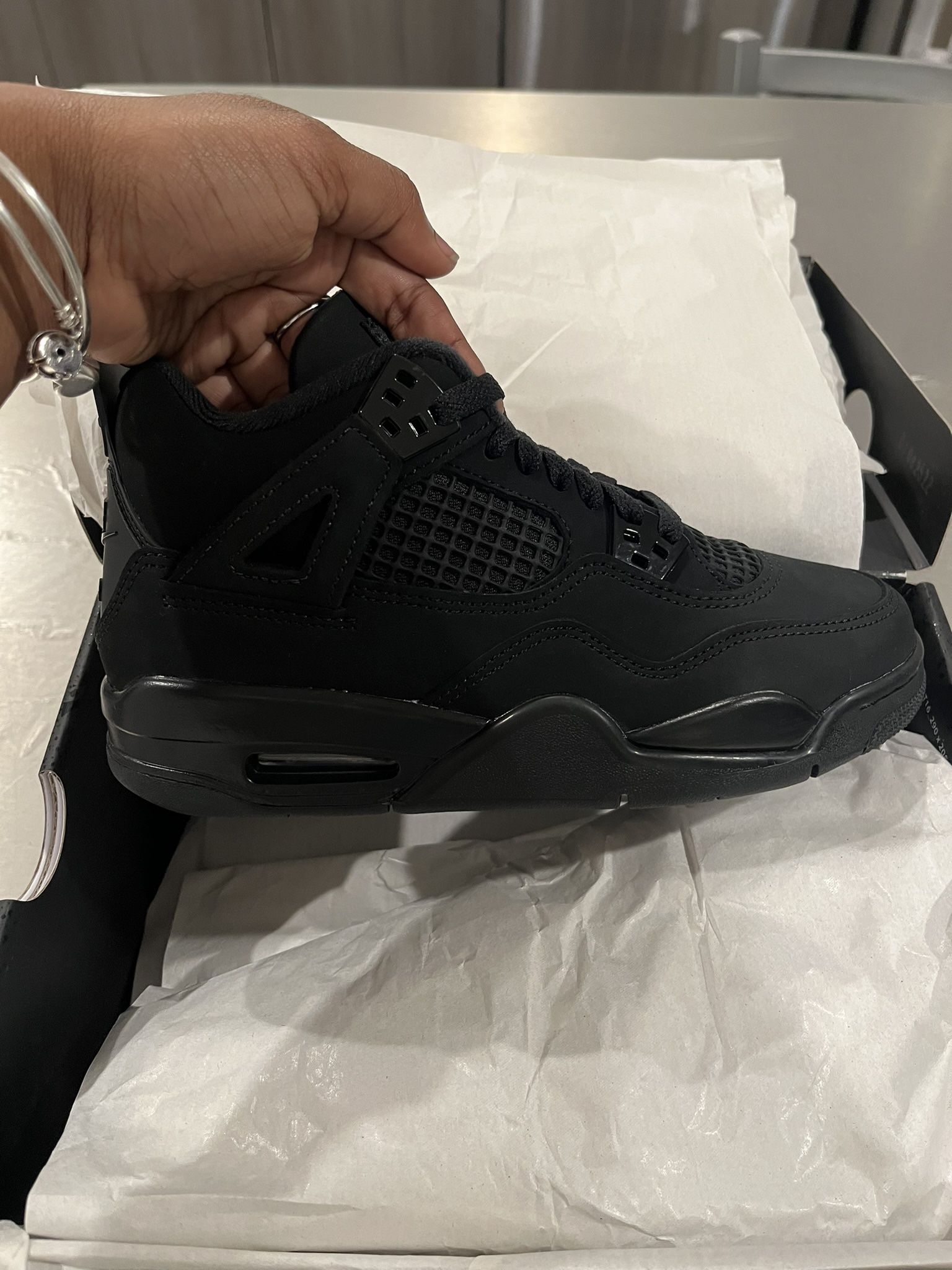 “Black Cat” Jordan 4 (2025)