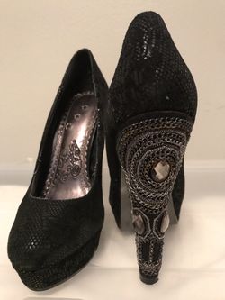 Black platform heels with embellishments