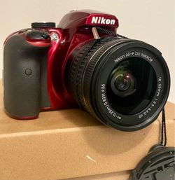 Red Nikon D3400 DSLR camera with AF-P DX 18-55mm Zoom Lens and More!