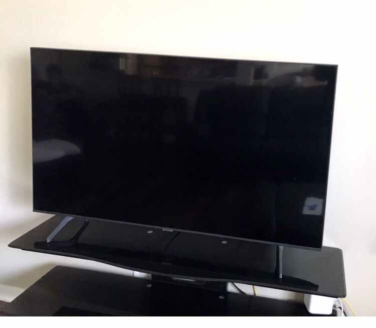 50” LG TV With 52” W x 15” D 3 Shelf  Black Glass TV Stand 