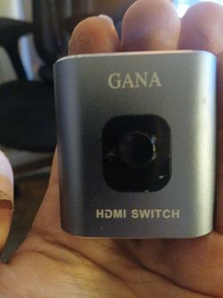 HDMI switch (2-in-1-out or similar 2-port aluminum model, ~4K@60Hz support).