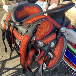 All kind of western boots, work boots for ladies also horse saddles cow hide belts cowboy hats 