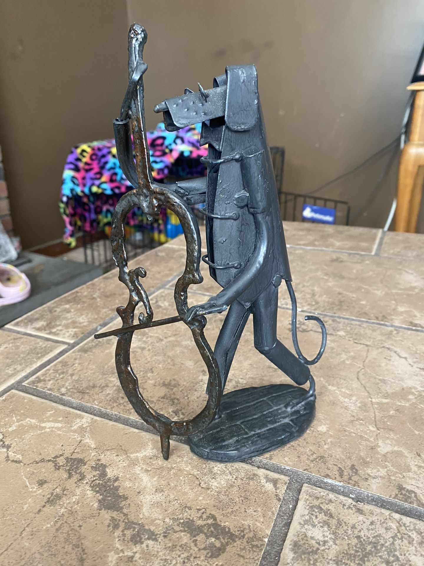 Metal Dog playing with a bass violin