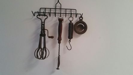 Antique kitchen tools. Farm hanging scale. Egg seperator, A and John Archimedes egg beater, Hand Mixer.