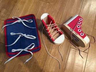2 Melissa & Doug wooden shoes and one learning to tie activity