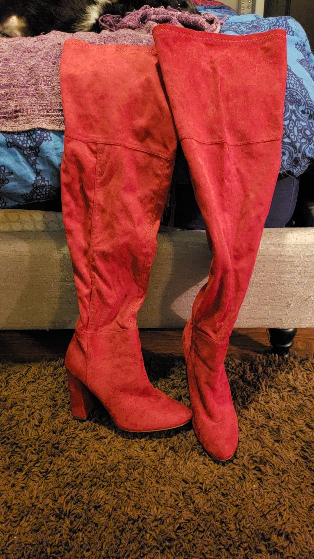 Red thigh high boots.