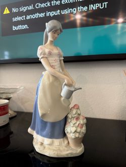 Porcelain Woman Figurine with Watering Can