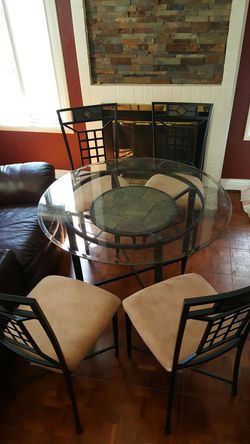 Kitchen glass table and chairs with slate tiles