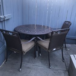 Table and three chairs