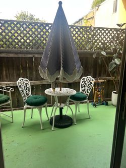 4 Piece Patio Set - White metal bistro table, chairs, and umbrella