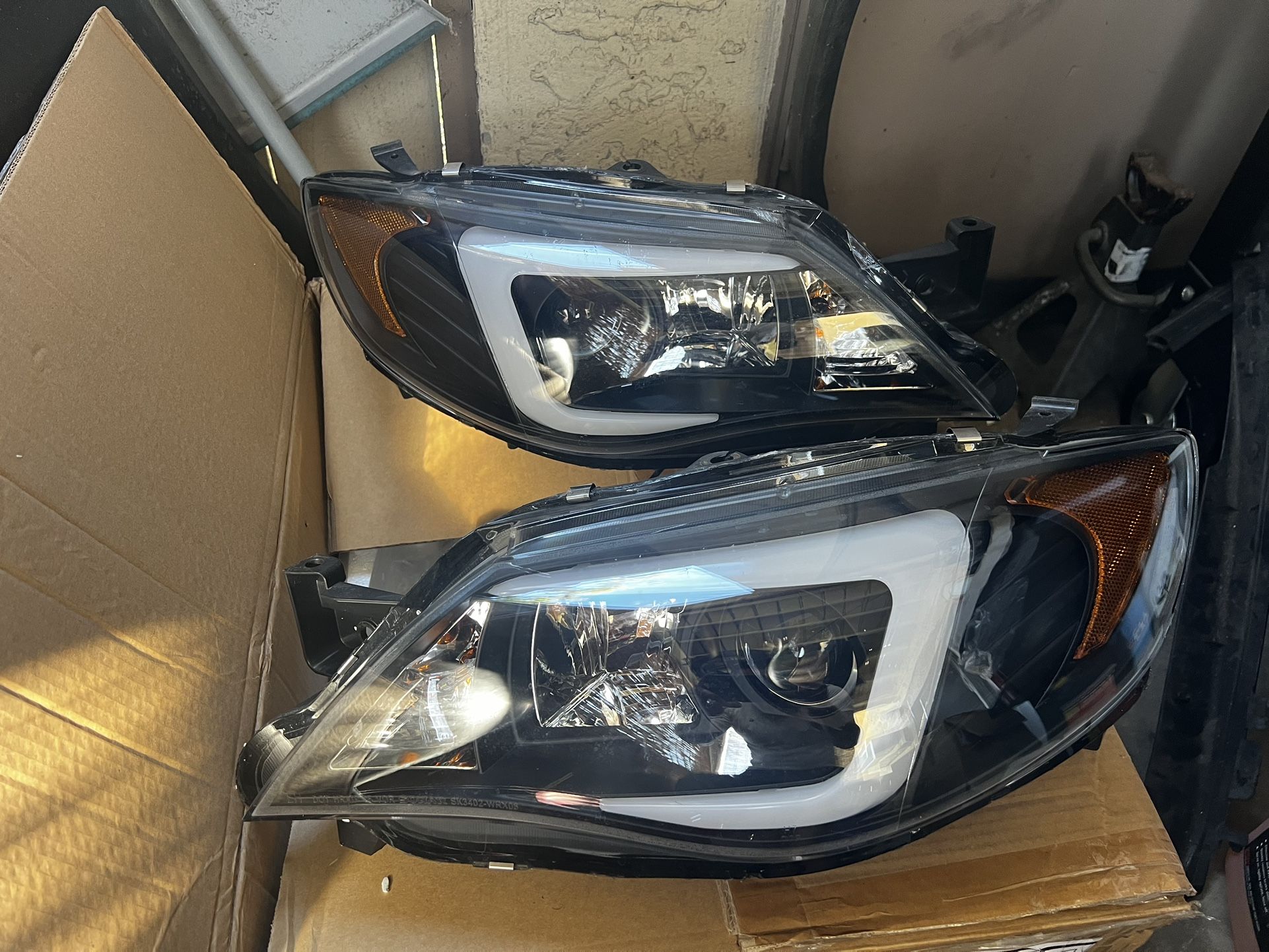 2008-2014 WRX/STI aftermarket headlights. lightly used