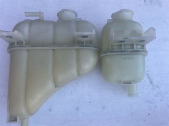 Q60 coolant reservoir/heat exchanger