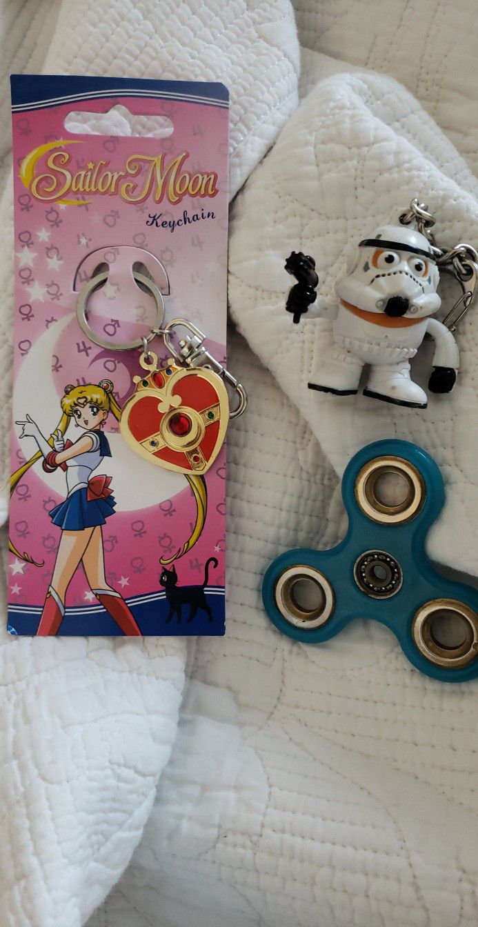 Sailor moon key chain a fibbit spinner and other key chain thing