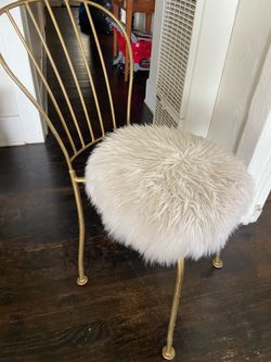 Metal chair and plush seat