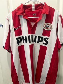 This is a vintage Nike PSV Eindhoven home shirt, recognizable by its classic red and white stripes