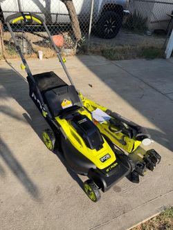 RYOBI 18V Lawn Mower Kit: 16-inch Lawn Mower and Trimmer, (1) 4Ah Battery, (1) 2Ah Battery, and (1) Charger.
