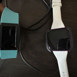 2 fitbit devices wirh extra bands and charges 