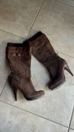 brown Guess knee-high boots with a high stiletto heel and platform