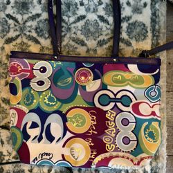     +4 This is a Coach Poppy Tote with a multicolor graffiti print.  