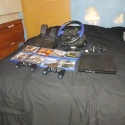 PlayStation 4 With 8 Games In A Wheel And A Controllers