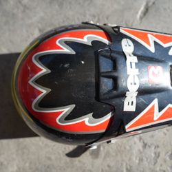 Vintage Adult XXL Motocross Helmet – BellVintage Bell motocross/full-face helmet in adult XXL. Classic retro graphics with black, red, yellow, and sil