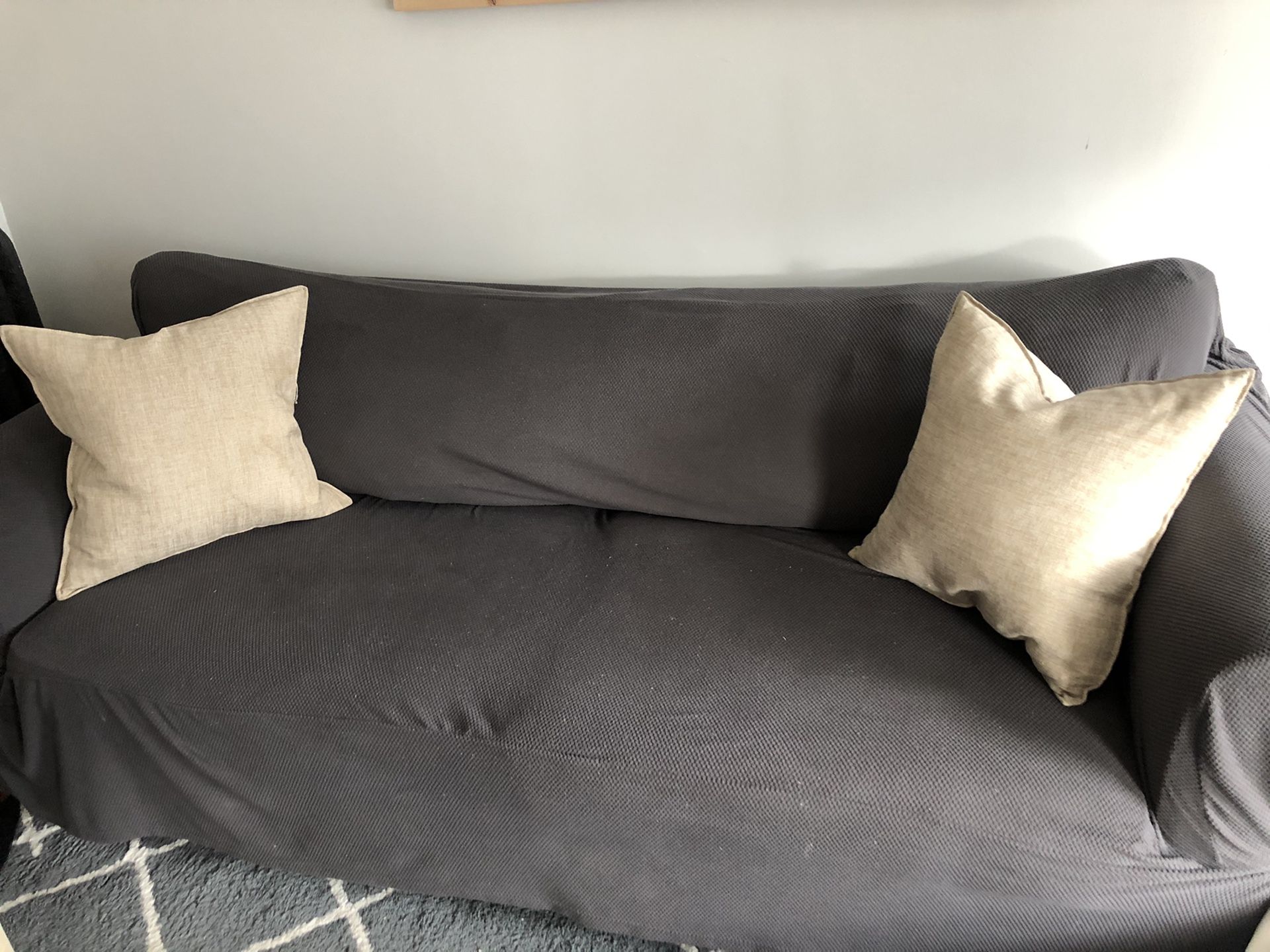 Couch with cover and pillows