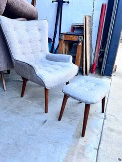 Light gray chair with footstool