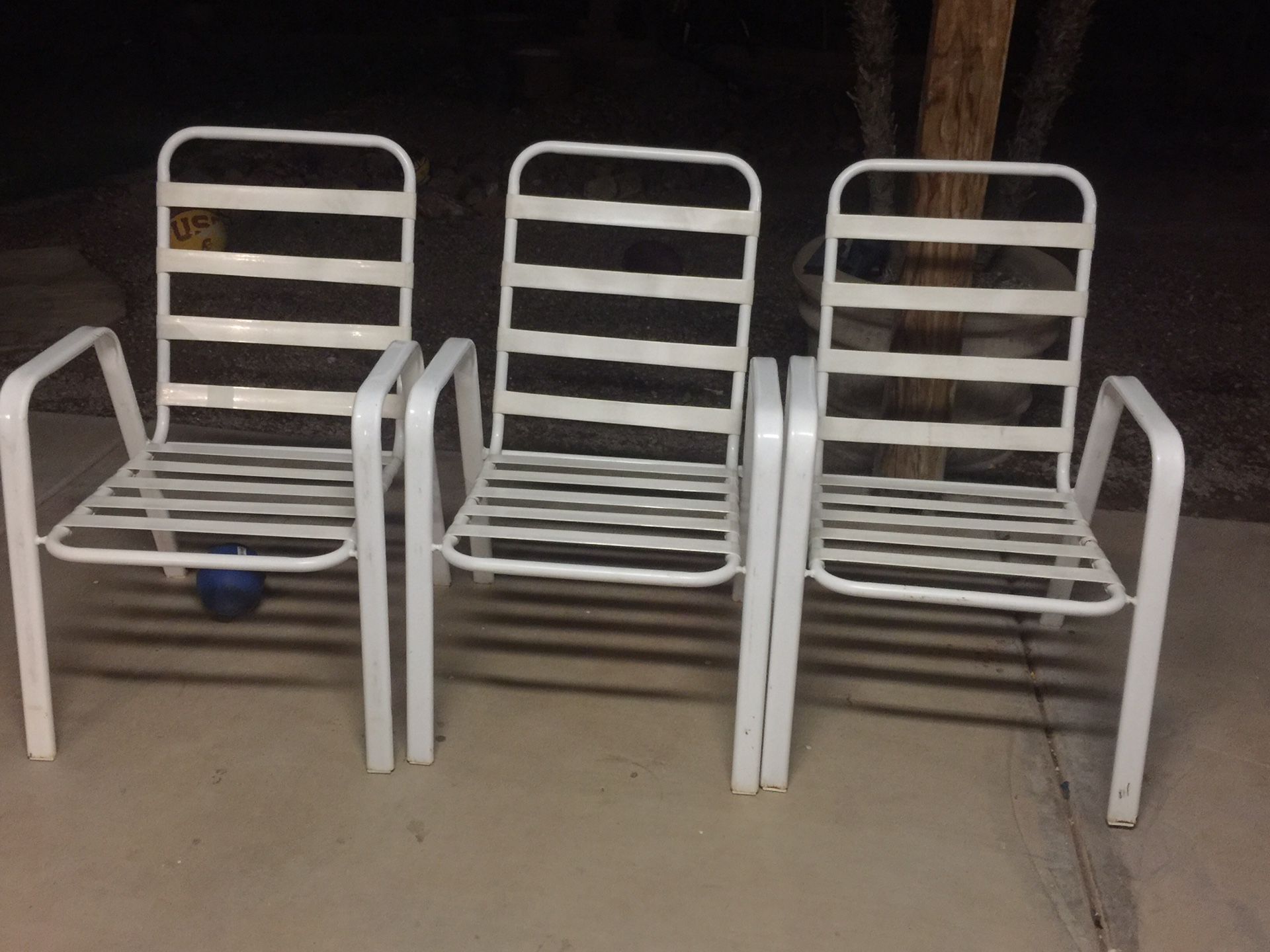 Set of three metal chairs. Shea design pool company.