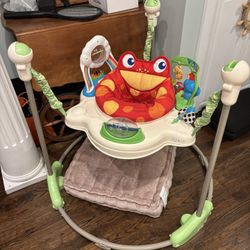 Fisher-Price Rainforest Jumperoo baby activity center with sounds and music