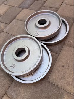 2 pairs of 10 pound deep dish Olympic weights