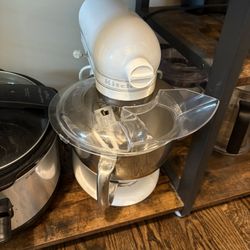 White Kitchen Aid Mixer.  Works Great.  It is missing the white knob on the side.  Still functions fine.  Comes with attachments. 